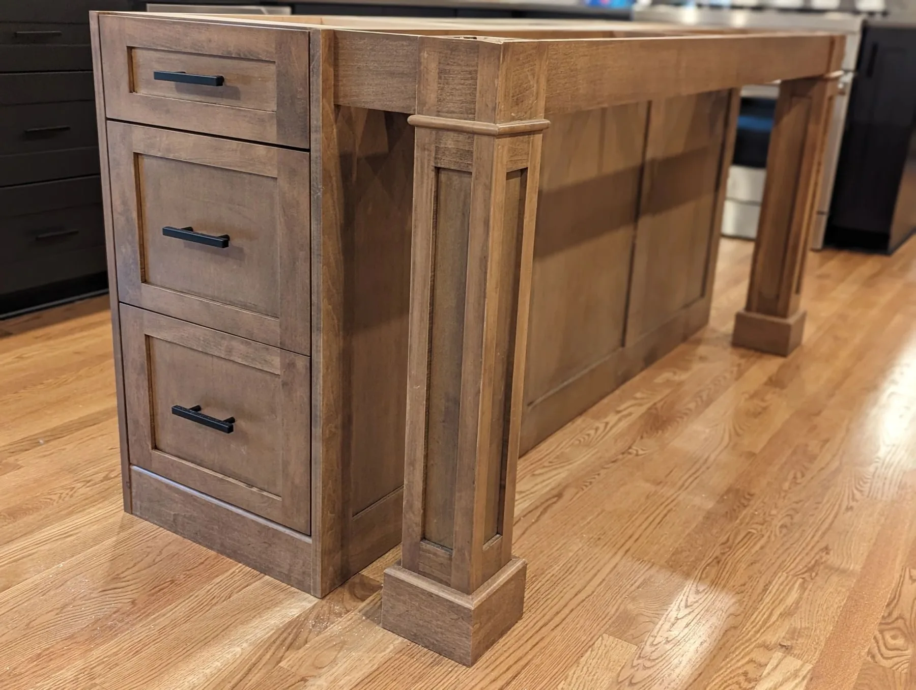 A custom kitchen island in stained maple