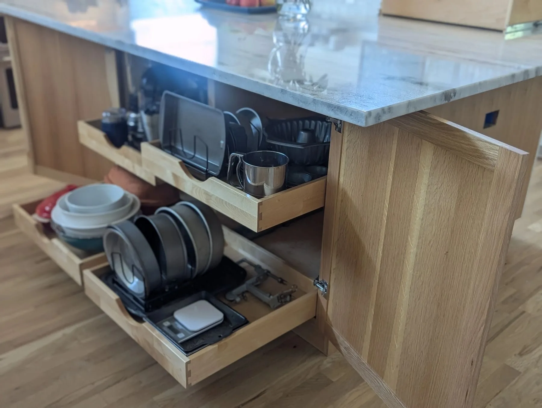 Island pull-out drawers holding cookware