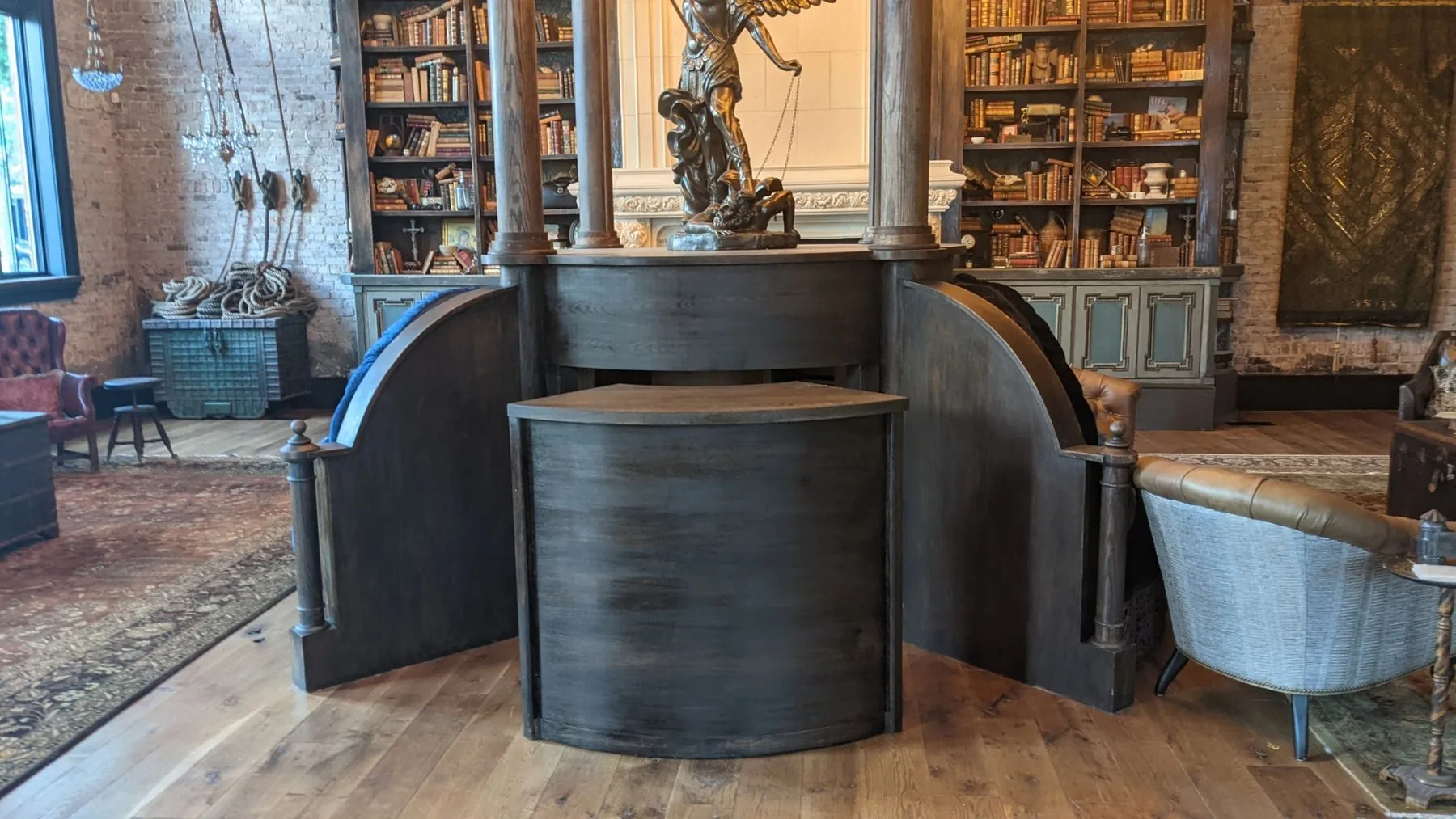 A custom-built lounge with curved woodwork and hanging lanterns