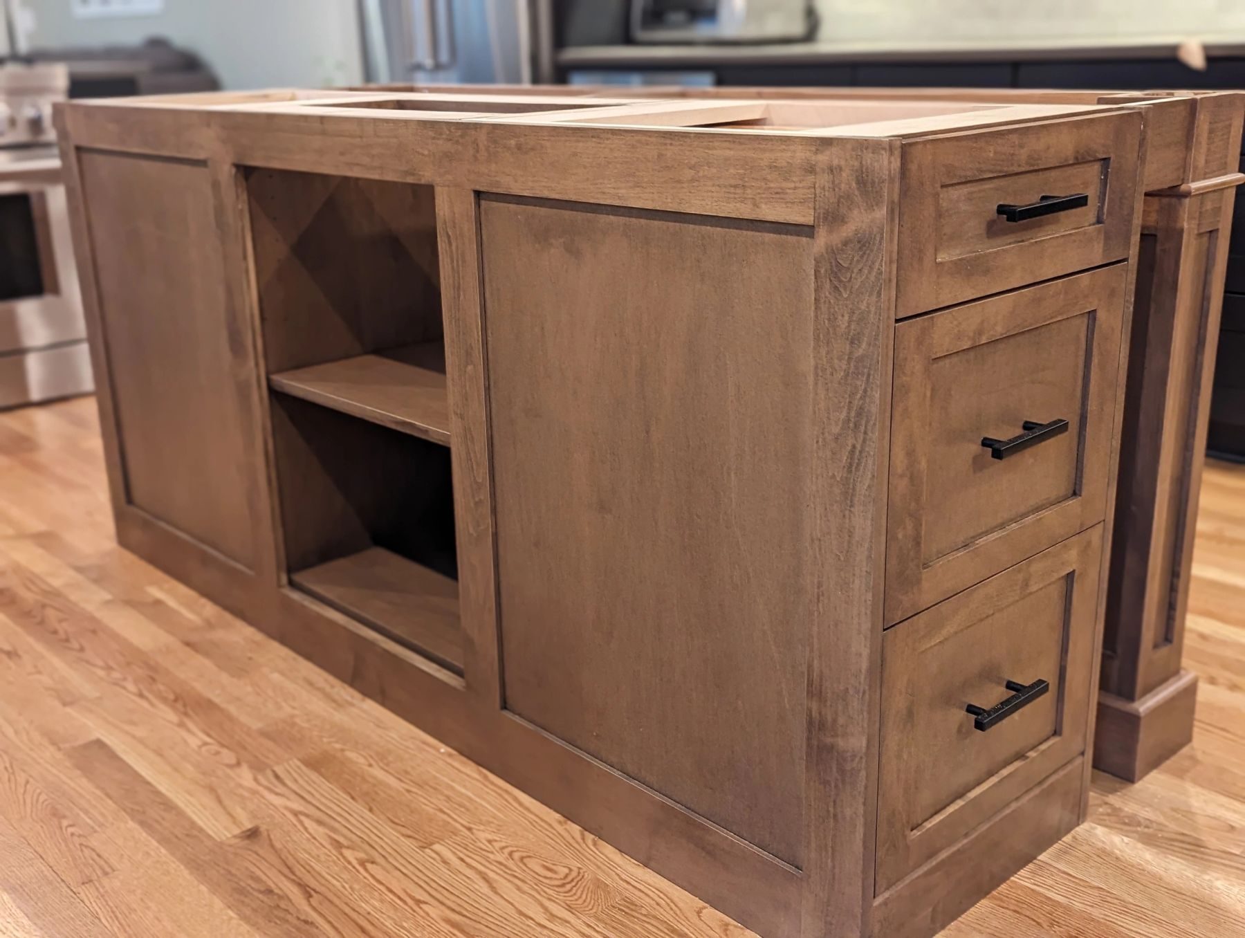 A custom kitchen island under construction in the workshop