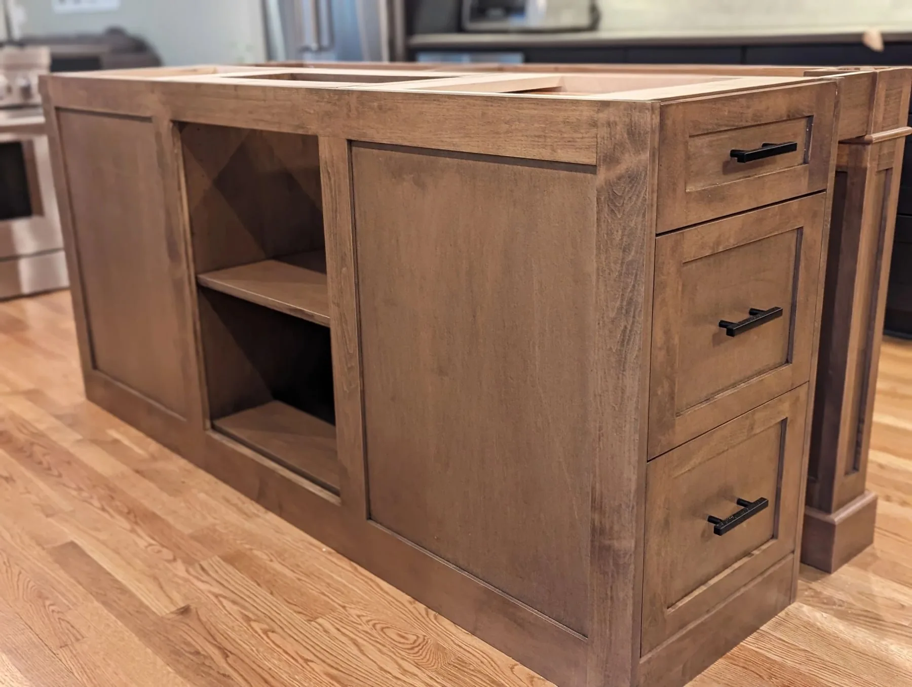 A custom kitchen island under construction in the workshop